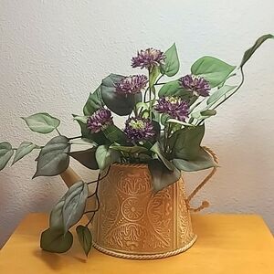 The Garden Collection metal watering can floral wall hanging